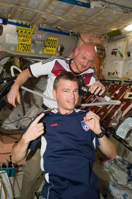 NASA image: Expedition 40 crew in Node 2 after German - U.S. soccer game