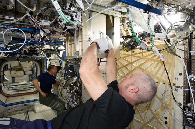 NASA image: Swans replacing filter in U.S. Laboratory