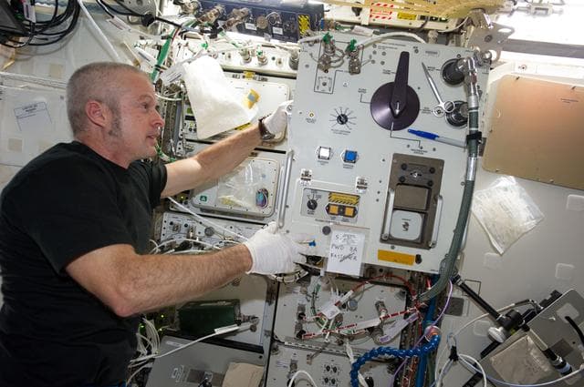 NASA image: Swans replacing filter in U.S. Laboratory