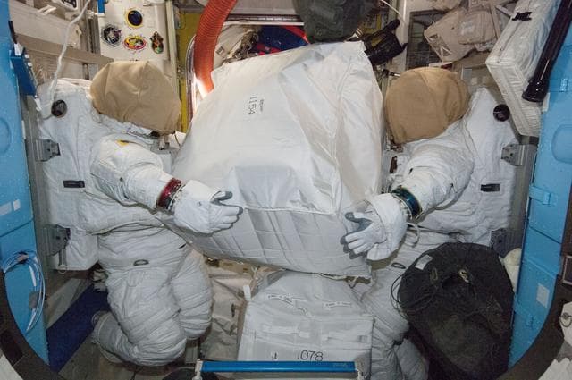 NASA image: EMUs in Quest airlock