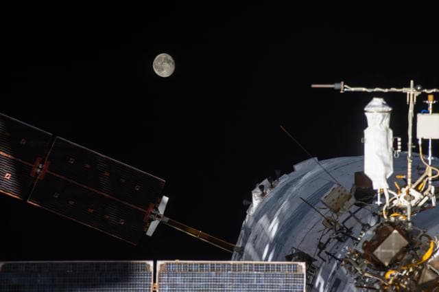 Supermoon setting behind ATV