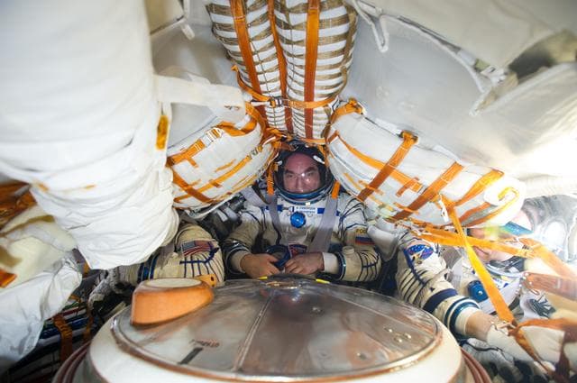 NASA image: 38S suit leak check before return