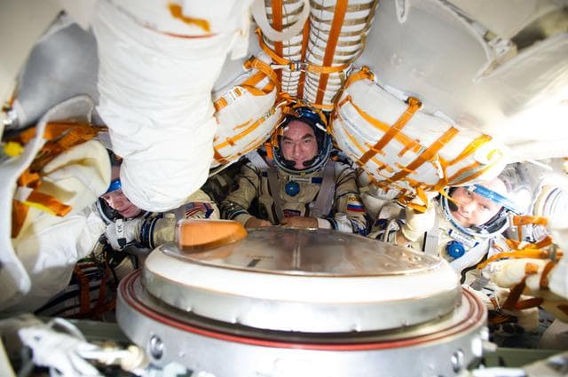 NASA image: 38S suit leak check before return