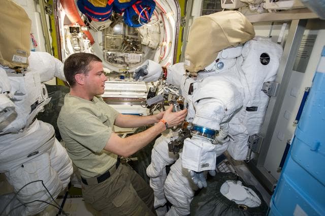 NASA image: Wiseman in the Quest A/L during EVA Preparation