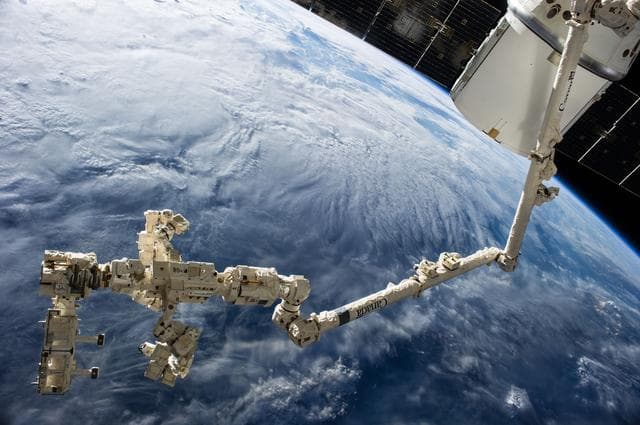 NASA image: SPDM DEXTRE carrying the Rapidsat Instrument Assembly