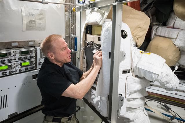 NASA image: Kopra during EMU spacesuit for Cooling Loop Maintnenace