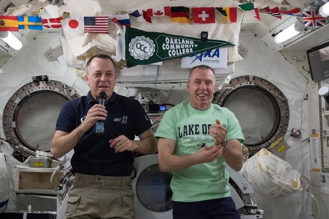 NASA image: Arnold and Feustel in JEM during talk with students