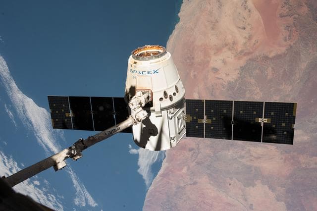 NASA image: SpX-14 Dragon in position for release