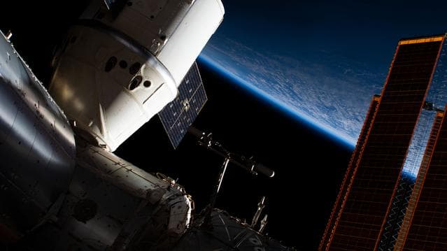 NASA image: The SpaceX Dragon above Alaska's Aleutian Islands in the Bering Sea