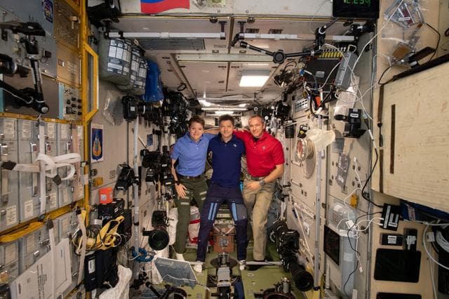 NASA image: Expedition 58 crew members gather inside the Zvezda service module