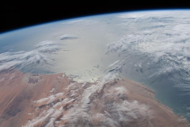 NASA image: The Sun's glint radiates off the Atlantic Ocean