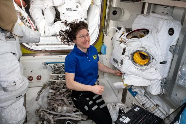 NASA image: Koch works with EMU in the Airlock