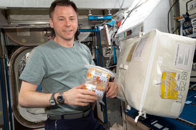 NASA image: Hague holding PCG Box Samples
