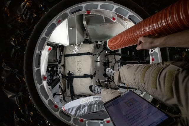 NASA image: iss067e266393 - Unloading SpaceX CRS-25 cargo