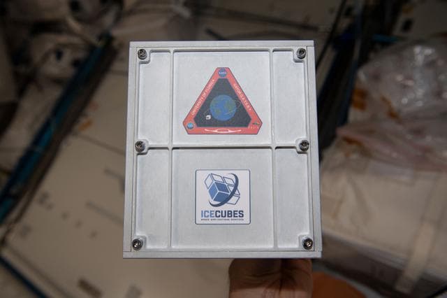 NASA image: Installation of external Experiment Cube #14 connected to ICE Cubes Facility front panel
