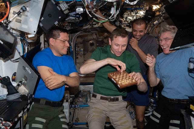 NASA image: Expedition 69 Flight Engineers play chess with NASA mission controllers