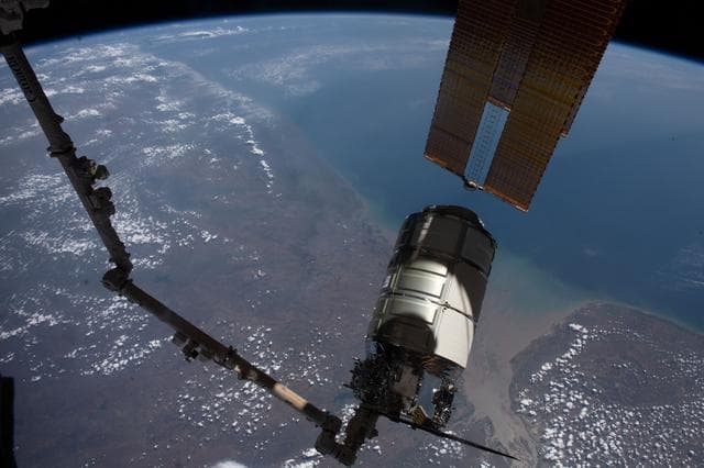 NASA image: The Cygnus space freighter in the grip of the Canadarm2 robotic arm