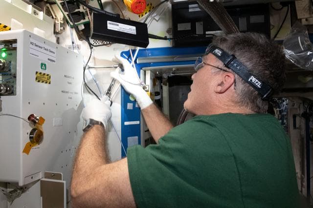 NASA image: Astronaut Stephen Bowen installs the H2 Sensor Demo