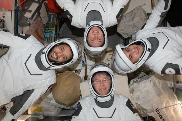 NASA image: Expedition 69 crewmates pose in SpaceX pressure suits