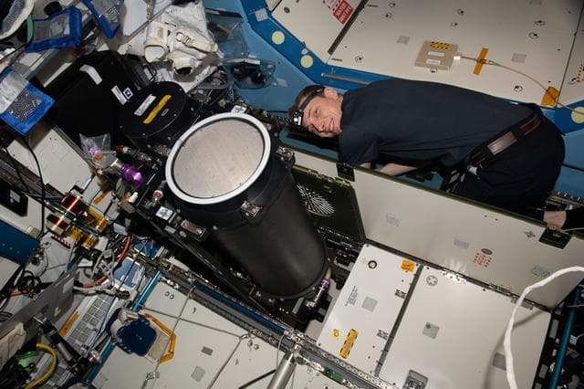NASA image: Astronaut Woody Hoburg replaces life support system components