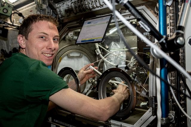 NASA image: Astronaut Woody Hoburg swaps samples
