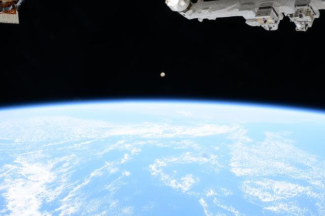 A Waxing Gibbous Moon Rises Over the Indian Ocean