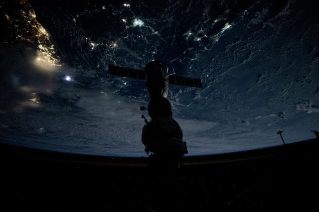NASA image: The Soyuz MS-25 crew ship is silhouetted against the backdrop of the Earth18