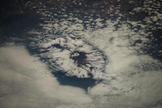 NASA image: Mount Kilimanjaro surrounded by clouds and the highest mountian in Africa