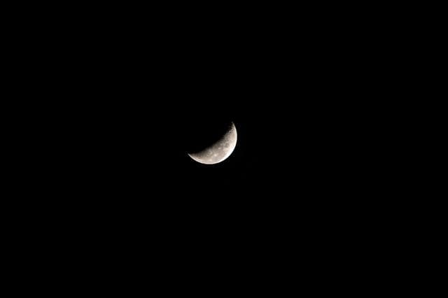 NASA image: A waning crescent moon hangs against the black of space