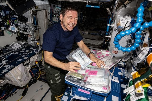 NASA image: NASA astronaut Mike Barratt collects and organizes medical supplies