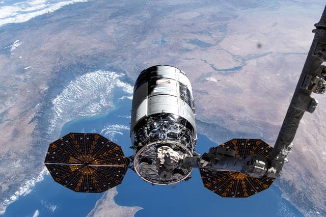 NASA image: Cygnus in the grips of the Canadarm2
