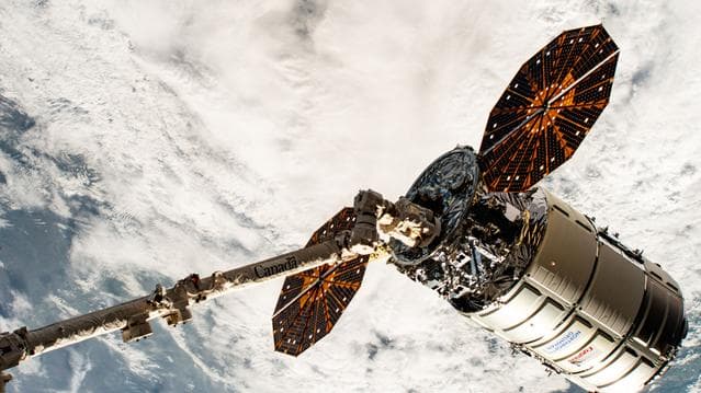 NASA image: Cygnus in the grips of the Canadarm2