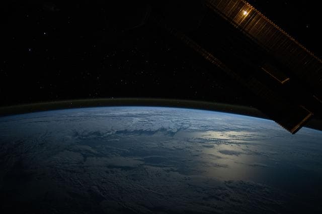 NASA image: The Moon's glint beams off the Pacific Ocean