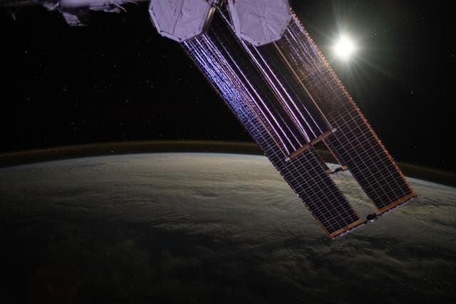 NASA image: The Moon illuminates a cloud-covered Pacific Ocean