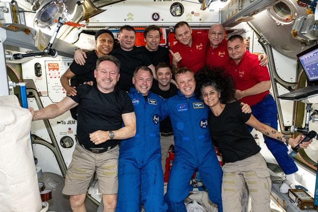 NASA image: The 11-member Expedition 72 crew poses for a portrait