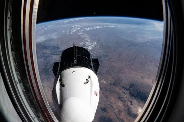 NASA image: The SpaceX Dragon Freedom spacecraft above the Sunflower State of Kansas