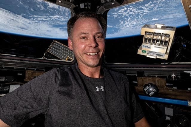 NASA image: Astronaut Nick Hague shows off space botany hardware