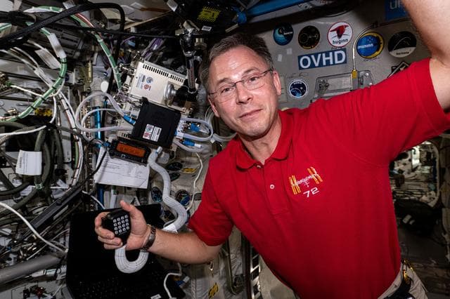 NASA image: Astronaut Nick Hague calls down to students on a ham radio