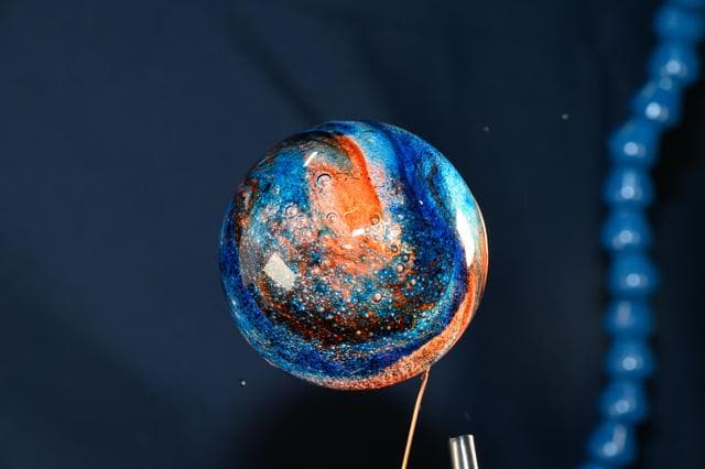 NASA image: Sphere of water filled with food coloring in microgravity
