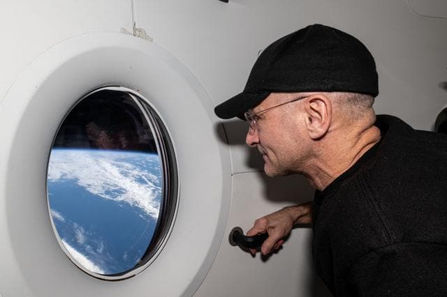 NASA image: Astronaut Don Pettit looks out a window on the SpaceX Dragon Endeavour spacecraft