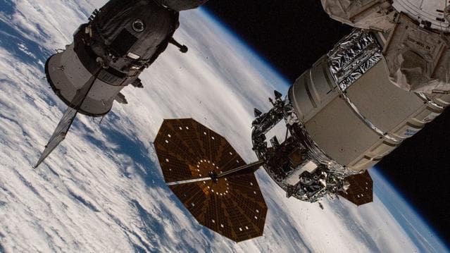 NASA image: The Cygnus cargo spacecraft and the Soyuz MS-26 crew ship
