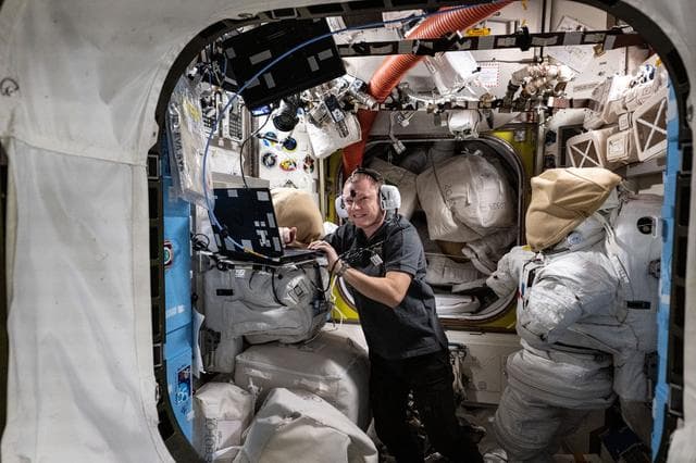 NASA image: Cosmonaut Aleksandr Gorbunov wears headphones and conducts a hearing test