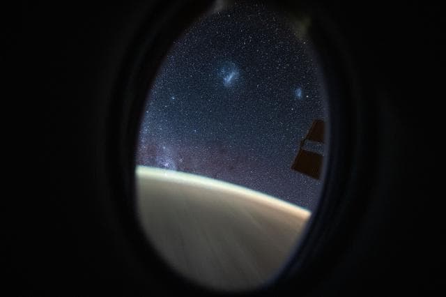 NASA image: The Megallanic Clouds seen from Dragon's window