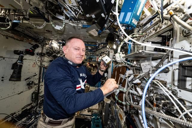 NASA image: Astronaut Butch Wilmore shows off 3D printing research hardware