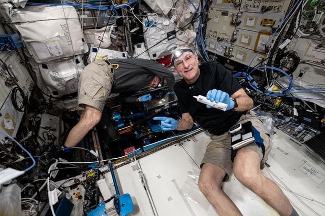 NASA image: Astronauts Butch Wilmore and Don Pettit install futuristic exercise gear