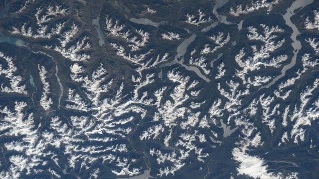 NASA image: The snow-tipped Andes mountain range and its many lakes