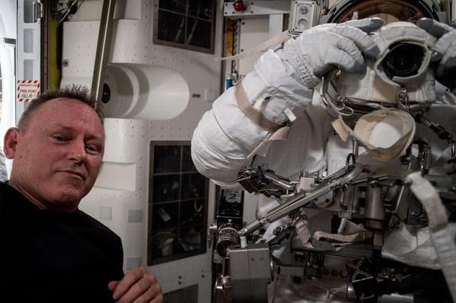 NASA image: NASA astronauts evaluate a spacesuit