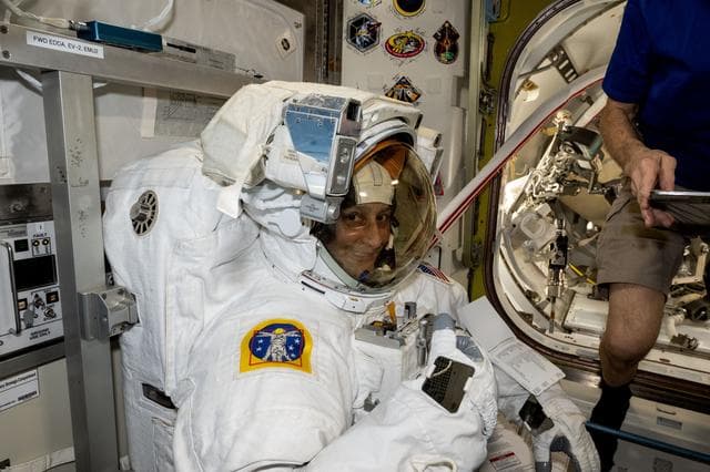 NASA image: Astronaut Suni Williams tries on and evaluates her spacesuit