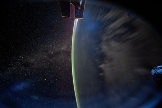 NASA image: The Milky Way appears beyond Earth's horizon