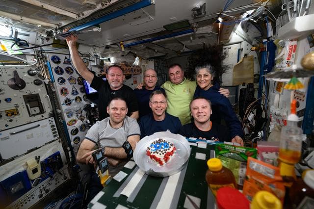 NASA image: The Expedition 72 crew poses for a portrait inside the Harmony module